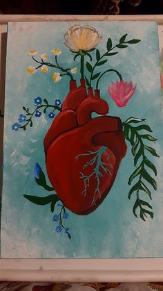 a painting of a heart with flowers and leaves on the side, painted in acrylic paint