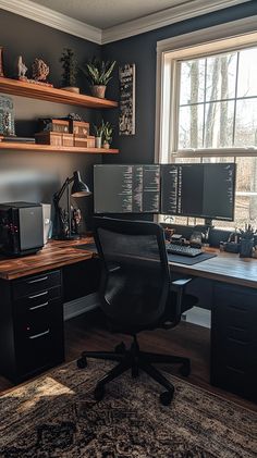 a home office with two computer screens on the desk