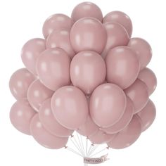 a bunch of pink balloons floating in the air