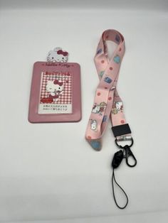 a hello kitty lanyard and key chain