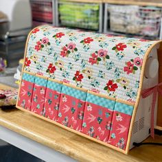 a sewing machine sitting on top of a wooden table