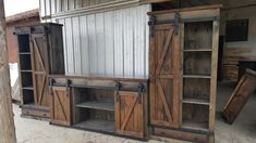 an old wooden cabinet with sliding doors and shelves