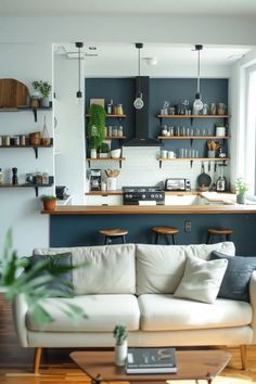 a living room filled with furniture and lots of shelves on the wall next to a window