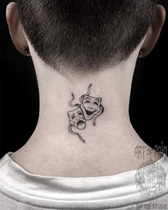 a man with a tattoo on his neck