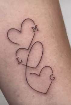 a couple of hearts with the letter m on it's side, and an arrow in the middle