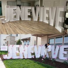 two people standing in front of a sign that says live, love, and flowers