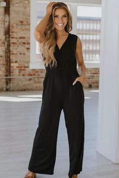 A sleek wide leg design, this jumpsuit offers a flattering and comfortable fit! 65% Viscose, 30% polyester, and 5% Elastane Black Wide Leg Jumpsuit, Top Graphic Tees, Leg Design, Wide Leg Jumpsuit, Dress Romper, Clothes Gift, Vest Dress, Sweater Hoodie, Vest Jacket