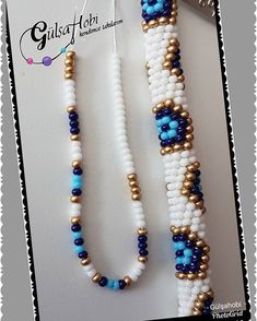 two beaded necklaces with blue and white beads are on top of each other