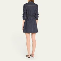 Cinq à Sept "Jenessa" indigo denim dress detailed with contrast topstitching and a D-ring belt Notched lapels; button closure Signature stylized sleeves Three-button cuffs Front flap patch pockets Mini length Cutaway hem A-line silhouette Cotton/polyester/elastane Dry clean Imported Fitted Denim Dress With Button Cuffs, Elegant Collared Denim Dress For Work, Elegant Denim Dress With Button Closure For Work, Collared Denim Dress With Button Closure For Work, Chic Button-up Denim Dress For Work, Dark Wash Denim Dress For Work With Button Closure, Dark Wash Denim Dress With Button Closure For Work, Indigo Denim Dress For Work, Navy Shirt Dress For Spring Workwear