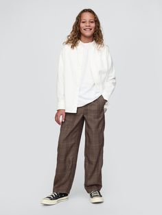 Soft, stretch poly-blend pull-on pants.  Elasticized waist with faux fly.  Side slant pockets, back welt pockets with button closures.  Allover plaid.  This pant is made with 70% recycled polyester.  Compared to virgin materials, using recycled materials helps to reduce resource use and waste.  Fit: Loose.  A roomy silhouette throughout.  Straight leg. Relaxed Fit Plaid Pants With Elastic Waistband, Gap Trousers For Fall, Gap Fall Trousers, Gap Pants With Welt Pockets For Workwear, Gap Workwear Pants With Welt Pockets, Gap Wide Leg Pants For Fall, Gap Wide Leg Fall Pants, Plaid Pants With Elastic Waistband For Work, Plaid Workwear Pants With Elastic Waistband