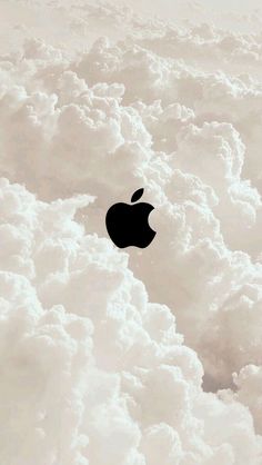 an apple logo is seen above the clouds