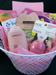 a pink basket filled with lots of beauty products