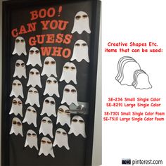 a door decorated with white ghost faces and text that says boo can you guess who?