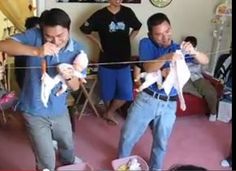 two men are holding cats in their hands while another man holds them up to his face