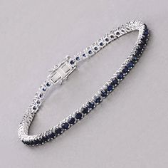 14k Gold Blue Sapphire Bracelet, Genuine Blue Sapphire Rounds Gold Bracelet for Women, Blue Sapphire Gold Tennis Bracelet, Gift for Her Dazzle in the deep blue allure of this 14K white gold tennis bracelet, featuring 6.38 carats of genuine round blue sapphires. Each sapphire is meticulously set to create a seamless line of vibrant color, perfect for adding a touch of luxury to any ensemble. The bracelet's classic design is enhanced by its secure box clasp, ensuring both elegance and peace of min Luxury Blue Diamond Bracelet For Anniversary, Luxury Blue Diamond Anniversary Bracelet, Blue Jewelry With Jubilee Bracelet For Anniversary, Blue Sapphire Diamond Round Bracelet, Round Sapphire Bracelet, Sapphire Jubilee Bracelet, Classic Blue Round Tennis Bracelet, Sapphire Sterling Silver Jubilee Tennis Bracelet, Blue Round Tennis Bracelet With Prong Setting