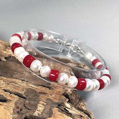 This beautiful bracelet is made from white genuine freshwater pearls and red-colored natural collar beads. These minerals are very well combined. Bracelet for men and women. June birthday gift. Sterling silver lobster lock. Details: * White pearl 4.4 mm/0.18'' * Red coral beads 3.4 mm/0.16'' * 925 sterling silver lobster clasp * 925 sterling silver jewelry accessories This is a handmade item. 100% repetition is impossible due to the individuality of the composition of the natural material. When Red Pearl Bracelets For Gifts, Red Pearl Bracelets As A Gift, Red Pearl Bracelets For Gift, Red Pearl Bracelet As A Gift, Red Pearl Bracelet As Gift, Red Pearl Bracelet Gift, Real Pearl Bracelet, Red Coral Jewellery, Silver Jewelry Accessories