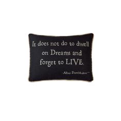 an embroidered pillow that says it does not do to dwelling on dreams and forget to live