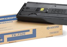 two black toner cartridges are sitting on top of each other in front of a box