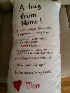 a pillow with a poem written on it that says,'a hug from home '