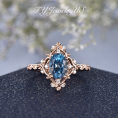 a ring with an opal surrounded by diamonds