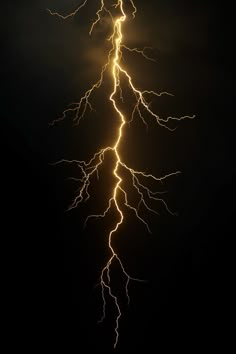 lightning strikes across the night sky with long exposure and brightening from its center beams