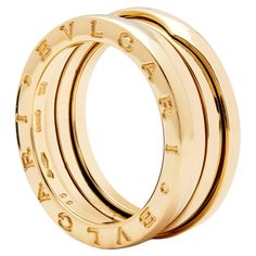 Beautiful Pre-owned Bulgari B-Zero ring, yellow gold, and ode to Italian architecture, taking inspiration from the famous Colosseum. A Classic and elegant ring suitable for daily wear. The purity of its distinctive spiral design, is a metaphor for the harmony of past, present and future. This is reflected in the magnificence of the eternal city - and the emblem of the pioneering spirit of the collection. Bulgari - B.zero1 ring yellow gold, signed and numbered, Italian assay marks 'Au 750', size Luxury Yellow Gold Engraved Ring, Luxury Stackable Rings With Polished Finish, Luxury Yellow Gold Stackable Rings, Designer 14k Rose Gold Rings, Designer Rose Gold 14k Rings, Luxury Formal Stackable Rings With Polished Finish, Luxury Gold Engraved Ring, Luxury Gold Stackable Rings With Polished Finish, Luxury Rose Gold Stackable Rings With Polished Finish