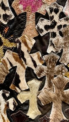 a close up view of an animal print fabric with different colors and patterns on it