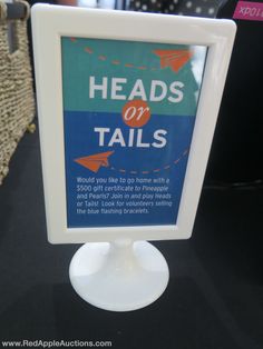 there is a sign that says heads or tails