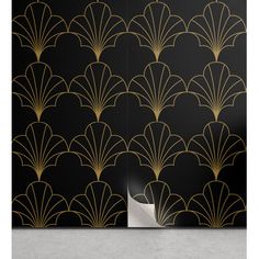 an art deco wallpaper design with black and gold fan pattern on the back side