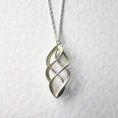 I have designed this elegant pendant and had it 3d printed and cast in sterling silver. It has a beautiful frosted finish with highly polished edges and it measures 30 x 15mm The necklace is in stock and will be dispatched within 1-3 working days via Royal Mail Recorded delivery. Elegant Pendant, Sterling Silber, 3d Printed, Royal Mail, Jewelry Necklace Pendant, Silver Necklace, Jewelry Necklaces, Twist, Pendant Necklace