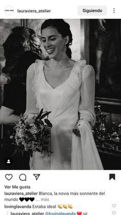 a black and white photo of a woman in a wedding dress with flowers on her bouquet