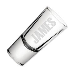 a silver shot glass with the name james written in white on it's side