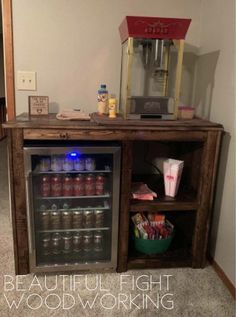 a small bar made out of an old wooden cabinet with the door open and some drinks in it