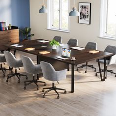 a large table with chairs around it in a room