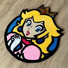 a rug with an image of princess peach from mario kart on it's floor