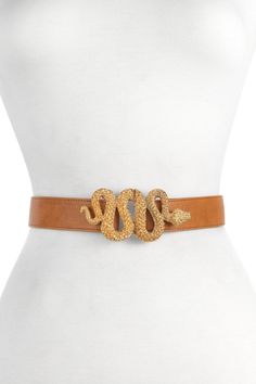 A glam take on the snake buckle trend. A gold-tone and textured snake takes center stage here and serves as the front clasp. Gold-tone slithering snake buckle. Fully adjustable. Leather construction. Approx. 1" width. Made in USA Gold Belt With Buckle Closure For Formal Occasions, Elegant Gold Belt With Buckle Closure, Chic Gold Belt With Buckle Closure, Chic Gold Belt, Slithering Snake, Venom Snake, Designer Belts, Fashion Belts, The Snake