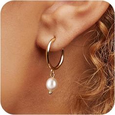 Product Details Material: Brass Metal: Yellow Gold Back Finding: Hinged Hoop Gem: Cubic Zirconia Item Type: Hoop Earrings These Elegant Pearl Hoop Drop Earrings Are A Stunning Blend Of Classic Sophistication And Modern Design. Featuring A Sleek Hoop That Gently Suspends A Lustrous Pearl, They Exude Timeless Beauty. The Smooth, Iridescent Surface Of The Pearls Reflects Light Beautifully, Creating A Captivating Shimmer With Every Movement. Perfect For Both Formal Occasions And Everyday Wear, These Wedding Earrings Gold, Gold And Pearl Earrings, Hoop Drop Earrings, Gold Earrings Wedding, Pearl Earrings Dangle, Dangling Earrings, Girly Jewelry, Wedding Board, Brass Metal