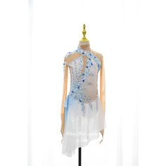 a white and blue dress on a mannequin