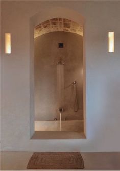 a bath room with a shower and a rug