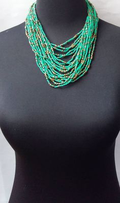 African beaded necklace made with the finest beads. Its a perfect accessory that will match most of your outfits. Suitable for any season. A good gift to your friends and loved ones. All our items are shipped through DHL Express. Delivered between 3 to 5 days. Turquoise Beaded Necklaces With Spacer Beads, Turquoise Beaded Necklace With Spacer Beads, Elegant Turquoise Faceted Beads, Elegant Faceted Turquoise Beads, Green Beaded Multi-strand Turquoise Necklace, Green Turquoise Necklace With Colorful Round Beads, Elegant Turquoise Beaded Necklaces With Spacer Beads, Elegant Turquoise Beaded Necklace With Spacer Beads, Elegant Turquoise Necklace With Spacer Beads