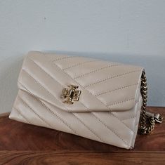 Tory Burch Brand Cross Body Wallet Bag Purse: 5 In Height 8.5 In Length 2 In Depth Cross Body Strap: 48 In Length 27 In From Shoulder To End Of Purse Brand New With Tags Classic Beige Shoulder Bag Clutch, Chic Tan Clutch For Everyday Use, Formal Beige Wallet On Chain With Chain Strap, Chic Beige Wallet On Chain With Chain Strap, Classic Beige Clutch For Daily Use, Classic Beige Rectangular Wallet On Chain, Elegant Beige Wallet On Chain With Chain Strap, Beige Leather Wallet On Chain For Evening, Beige Clutch With Magnetic Closure For Formal Events