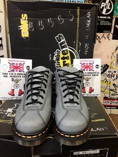 This original Made in England Dr Martens boot is not your usual style they produce, but they are very nice indeed. This is a 7 eyelet ankle boot that has been finished in a neutral blue leather that's very strong and good to wear in all weather's. It has the traditional trade mark yellow stitching and air cushioned sole unit with a BLACK leather strip art the back of the boot. It has potmark holes punched in to the leather on both feet, giving  it that more individual look. Steel Toe Lace-up Boots For Streetwear, Streetwear Ankle Lace-up Boots With Reinforced Heel, Streetwear Lace-up Ankle Boots With Reinforced Heel, Lace-up Work Boots With Reinforced Heel For Streetwear, High-top Boots With Reinforced Heel For Streetwear, Steel Toe Lace-up Moto Boots For Streetwear, Blue Leather Round Toe Moto Boots, Lace-up Martin Boots With Reinforced Heel For Streetwear, Casual Steel Toe Ankle Boots