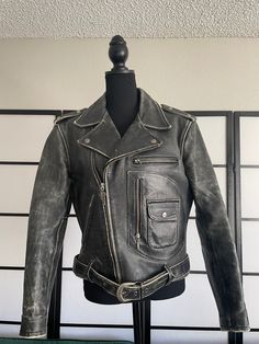 Hello and welcome. The whole point of my shop is to take someone else's "trash" or overlooked items, and bring them back to life.  This listing is for a distressed vintage Harley Davidson official screaming eagle club motorcycle leather jacket. lining and leather are in good condition. the distressed look is the original style of the jacket. I can condition and clean it before shipping if you would like. One zipper pull missing from one of the sleeves but the zippers are all in working order.  m Distressed Vintage Biker Jacket, Vintage Distressed Biker Jacket, Distressed Fitted Biker Jacket For Events, Rugged Distressed Leather Jacket For Streetwear, Distressed Moto Leather Jacket For Biker Events, Distressed Vintage Biker Jacket For Fall, Vintage Distressed Brown Fitted Biker Jacket, Vintage Fitted Distressed Brown Biker Jacket, Fitted Distressed Vintage Biker Jacket