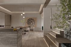 an open concept kitchen and dining area with wood flooring