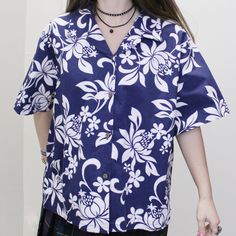 Vintage 90s Hawaiian T-shirt! Navy Blue Tropical button up with floral pattern throughout. Size 2X by MD, Made in Hawaii  Chest: 53 Waist: 51 1/2" Length: 24 3/4" MD Blue Hawaiian Shirt BD 6.2 oz. Blue Hawaiian Shirt With Floral Print, Hawaiian Shirt With Floral Print And Camp Collar, Casual Blue Hawaiian Shirt With Hibiscus Print, Casual Blue Camp Shirt With Hibiscus Print, Blue Hawaiian Shirt With Floral Print And Camp Collar, Blue Collared Hawaiian Shirt With Floral Print, Blue Hawaiian Shirt With Hibiscus Print For Spring, Spring Blue Hawaiian Shirt With Hibiscus Print, Blue Short Sleeve Hawaiian Shirt With Hibiscus Print