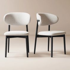 two chairs with black legs and white upholstered backrests, side by side