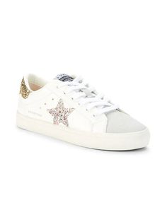 Please note: Customer feedback suggests this item runs large. Consider ordering a size down..These trendy, eye-catching sneakers are designed with glitter detailing, perforations and star motifs..Textile, synthetic & leather upper.Round toe.Lace-up vamp.Lining: Textile & synthetic.Padded insole.Synthetic sole.Imported.SIZE.Platform, 1' (25mm).Please note: Customer feedback suggests this item runs large. Consider ordering a size down. These trendy, eye-catching sneakers are designed with glitter White Leather Sneakers With Glitter Accents, Sporty Leather Sneakers With Glitter Accents, White High-top Sneakers With Glitter Accents, White Leather Sneakers With Glitter, White Leather Glitter Sneakers, Casual Leather Sneakers With Glitter Accents, Leather Sneakers With Glitter Accents And Round Toe, Low-top Leather Sneakers With Glitter Accents, Sporty High-top Sneakers With Glitter Accents