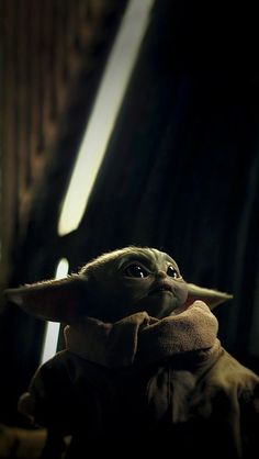 the child yoda is looking up at something