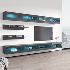 a modern living room with white walls and blue lights on the entertainment center, built in bookshelves