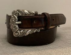 Fossil ‘98 Embossed Leather Southwest Belt, Silver Buckle, Brown, Conchos, Womens by JdinowitzRetro on Etsy Designer Silver Belt With Buckle Closure, Elegant Brown Belt Buckle, Brown Belt Buckle With Buckle Closure For Formal Occasions, Brown Formal Belt Buckle With Buckle Closure, Formal Brown Belt Buckle With Buckle Closure, Luxury Silver Belt With Buckle Closure, Formal Brown Belt Buckle With Closure, Leather Concho Belt Buckles For Formal Wear, Silver Leather Belt With Buckle Closure